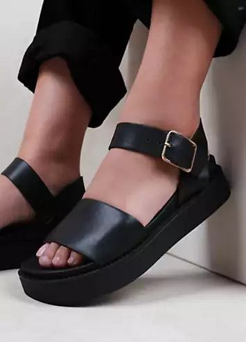 Where’s That From Phoenix Black Wide Fit Buckle Flat Sandals | Kaleidoscope